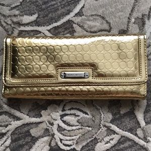 Small gold Nine West wallet clutch.